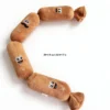Sausage Squad 4-Squeak Plush Dog Toy shown on a white background with a 58 cm / 22.8 in length and 4.5 cm / 1.7 in width size guide.
