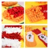 Close-up of treat-hiding zones on a yellow dog snuffle mat, including flower folds, fry pockets, sauce sleeves, and chenille strips.