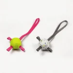 large-etpu-dog-fetch-ball-with-strap-two-colors Two soft-bite ETPU dog fetch balls with straps on a white background, shown in White with Gray Strap and Lime with Pink Strap.