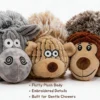 Close-up of Gray Sheep, Cream Bear, and Cocoa Monkey plush dog ball toys showing fluffy texture and embroidered face details.