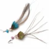 peacock-feather-bird-cat-wand-replacement-lures Two Peacock Feather Bird Cat Teaser Replacement Lures with fluffy deer-hair heads, long feather tails, bells, and metal snap connectors on white.