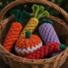Autumn harvest collection of carrot, pumpkin, eggplant, and chili pepper vegetable dog toys made from colorful braided cotton rope for puppies and small dogs.