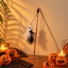 Ghost Halloween cat toy wand with fluffy feather attachment for playful chasing and interactive cat play.