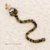 70cm green leopard catnip snake with plush body and crinkle features for wrestling and kicking.