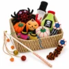 Halloween cat toy gift box filled with plush pumpkin, spider, ghost and interactive teaser wand toys for a festive cat celebration.
