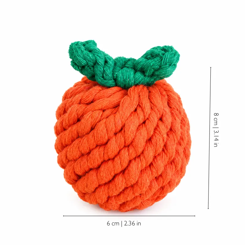 Orange fruit-shaped cotton rope dog toy with green leaves, measuring about 8 x 6 cm for indoor fetch and carrying.