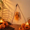 Pumpkin Halloween cat toy wand with orange feather teaser for seasonal interactive play with cats.
