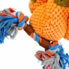 Close-up of colorful blue, orange, and gray cotton rope knots and tassels attached to the chicken stuffed toy's orange, nubby-textured plush body.
