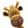 Close-up of the giraffe plush face, showing its brown muzzle, stitched smile, black eyes, ears, and textured mustard-yellow fabric.
