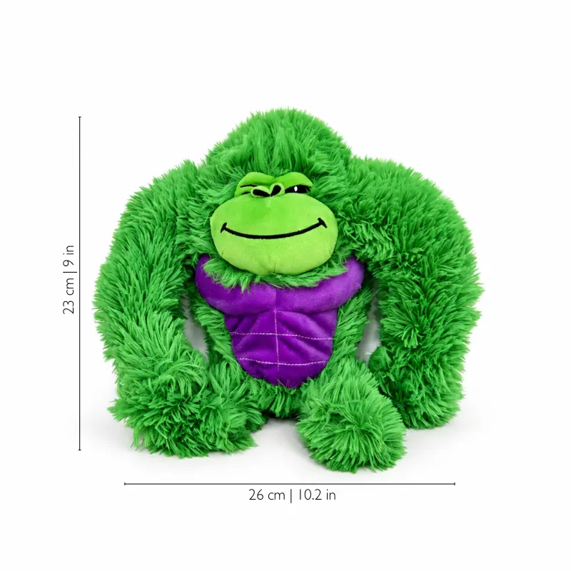 green-gorilla-plush-size Green gorilla plush with long shaggy arms, a purple belly and a mischievous smile, shown with 26 cm width and 23 cm height markings.