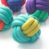 pp-braided-rope-ball-dog-toy-material-detail Close-up view of the tightly woven PP braided rope texture on a colorful rope ball dog toy, showing the durable knot structure and detailed bite rope surface for interactive play.