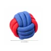 red-blue-rope-ball-dog-toy Red and blue rope ball dog toy with a woven knot ball design, offering a bright grabbing point for dogs who love carrying, shaking, and tug play.