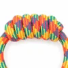 Close-up of the thick wrapped hand grip on the rainbow dog tug rope, showing the tightly woven rope texture designed for owner handling during tug play.